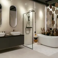 Une salle de bain zen avec double vasque, douche à l'italienne et baignoire îlot. Ambiance apaisante et naturelle.