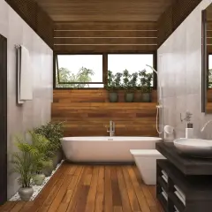Salle de bain moderne avec baignoire, lavabo et toilettes. Le sol en parquet contraste avec le carrelage mural.