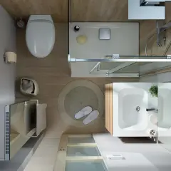 Vue aérienne d'une salle de bain moderne et épurée. Toilette, douche, lavabo, et radiateur créent une ambiance salle de bain apaisante.