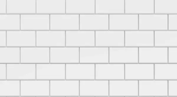 Vue rapprochée d'une pose carrelage métro blanche, avec des carreaux rectangulaires disposés en quinconce.
