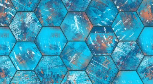 Carrelage écologique hexagonal aux teintes bleues et orangées, évoquant une texture usée et artistique.
