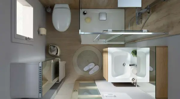 Vue aérienne d'une salle de bain moderne et épurée. Toilette, douche, lavabo, et radiateur créent une ambiance salle de bain apaisante.