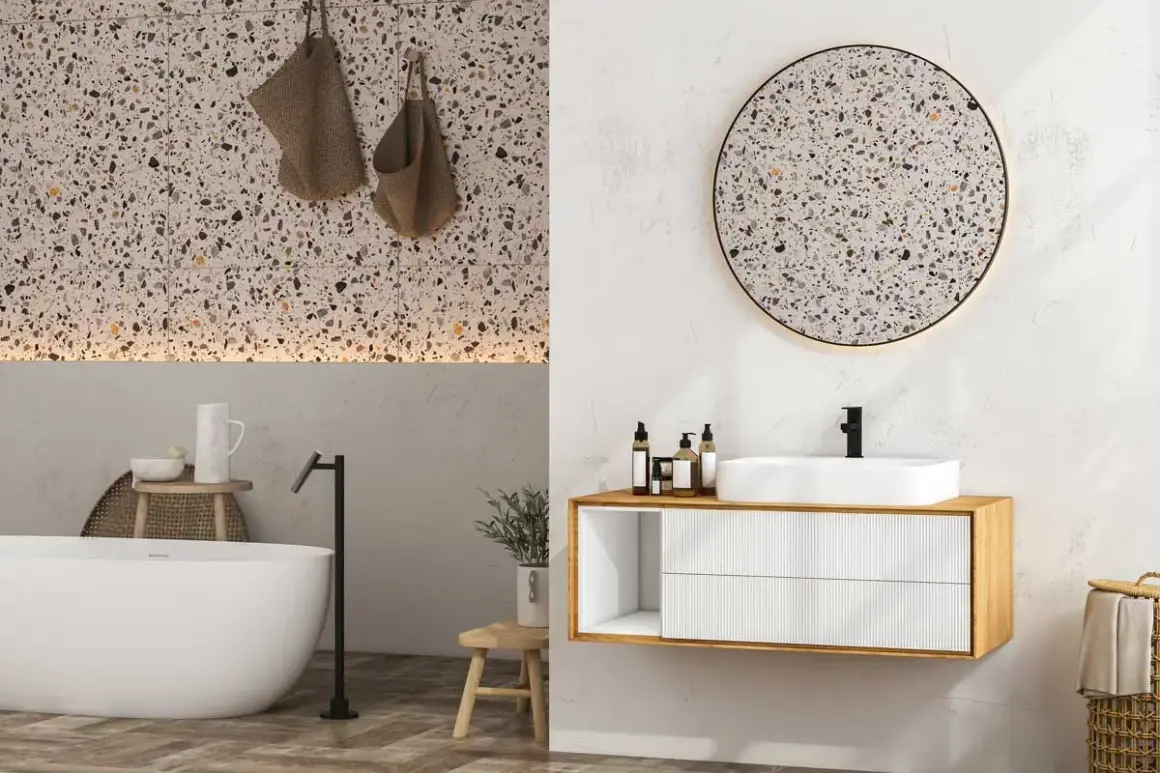 Élégante salle de bain terrazzo avec baignoire, lavabo moderne et miroir rond.
