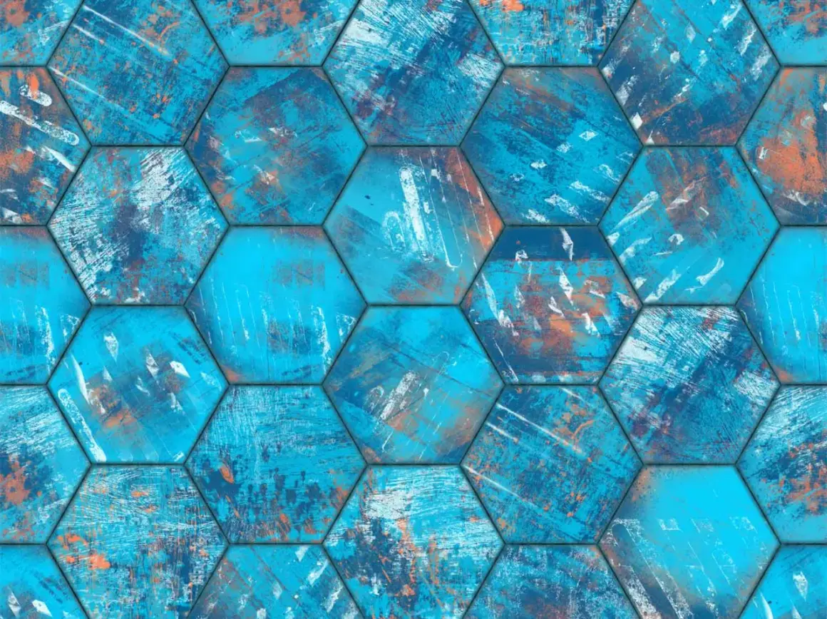Carrelage écologique hexagonal aux teintes bleues et orangées, évoquant une texture usée et artistique.