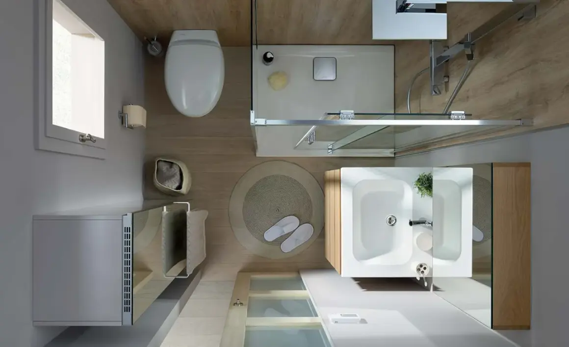 Vue aérienne d'une salle de bain moderne et épurée. Toilette, douche, lavabo, et radiateur créent une ambiance salle de bain apaisante.