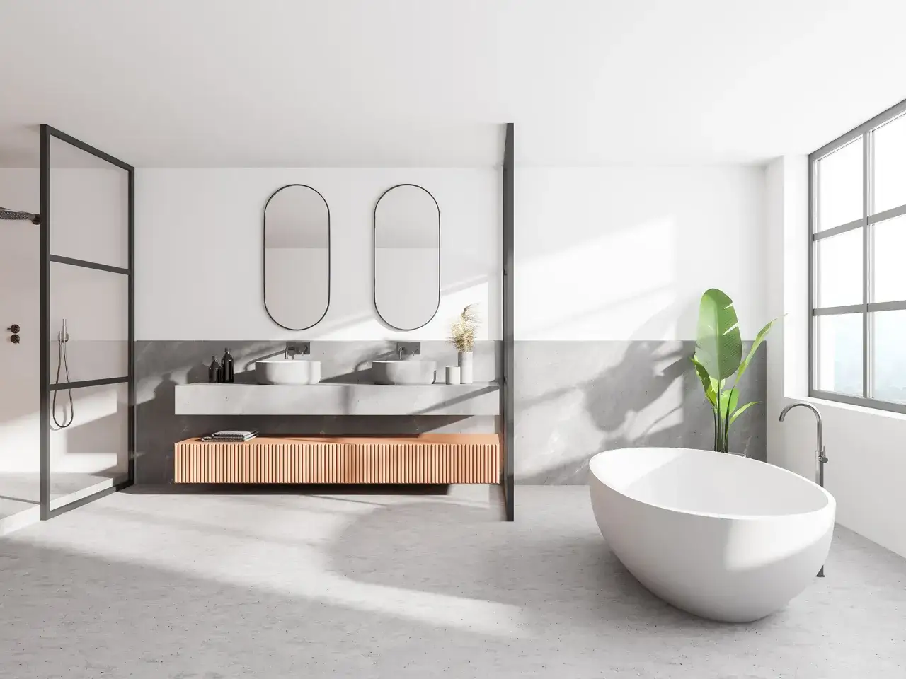 Salle de bain moderne avec douche sans carrelage, double vasque, baignoire îlot et grande fenêtre.