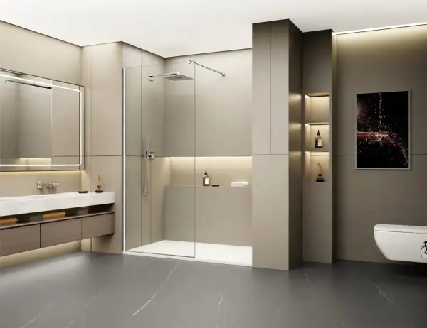 Salle de bain moderne avec un grand miroir lumineux, un lavabo suspendu et une spacieuse cabine de ressaut douche en verre.