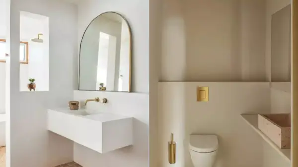 Salle de bain moderne avec lavabo flottant, miroir arche et WC suspendu. Une belle deco wc petit espace avec des touches dorées.