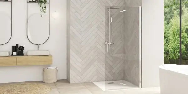 Salle de bain moderne avec paroi de douche en verre, idéale pour enlever calcaire paroi douche. Double vasque et baignoire invitent à la détente.